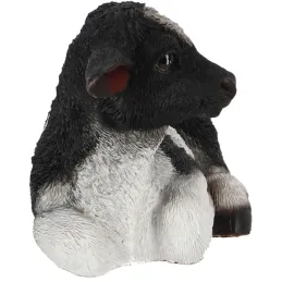 Veau noir et blanc couché en résine