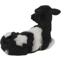 Veau noir et blanc couché en résine