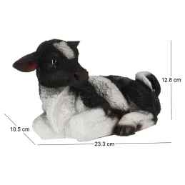 Veau noir et blanc couché en résine
