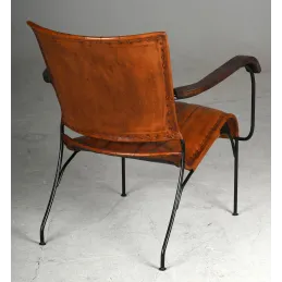 Fauteuil en cuir de buffle, métal et bois verni