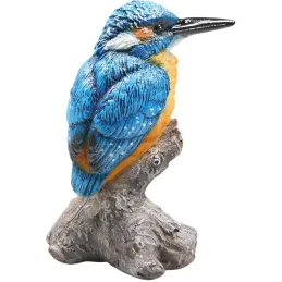 Oiseau martin pêcheur sur tronc en résine