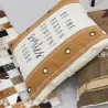 Coussin en coton beige à rivets