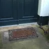 Paillasson en fonte et rouleau coco