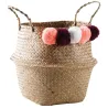 Panier rond en jonc naturel avec pompons
