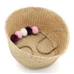 Panier rond en jonc naturel avec pompons