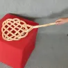 Tapette à tapis en rotin