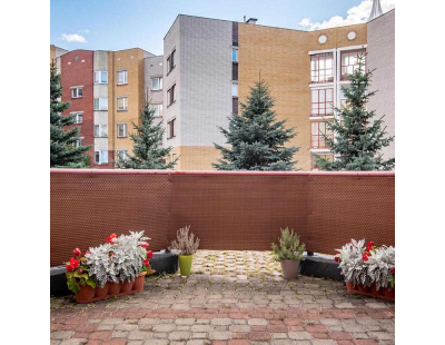 Brise-vue en résine tressée avec oeillets métalliques coloris miel (0.9 x 3 m)